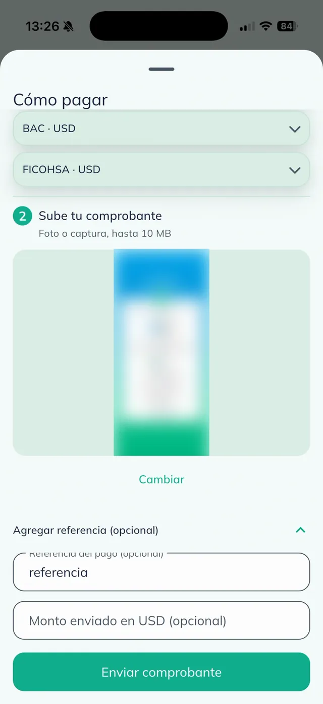 Sección "Sube tu comprobante" con la imagen del comprobante bancario adjunta (difuminada) y el enlace "Cambiar".